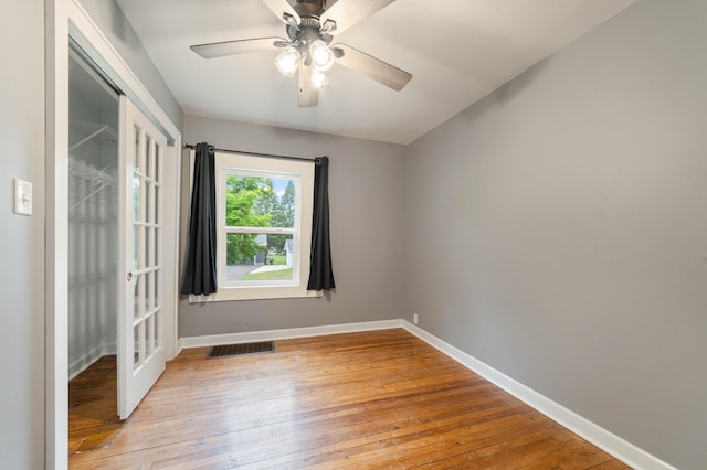 1921 Minneapolis Ave, Duluth, MN 55803 - empty room featuring wood-type flooring, a ceiling fan, and french doors