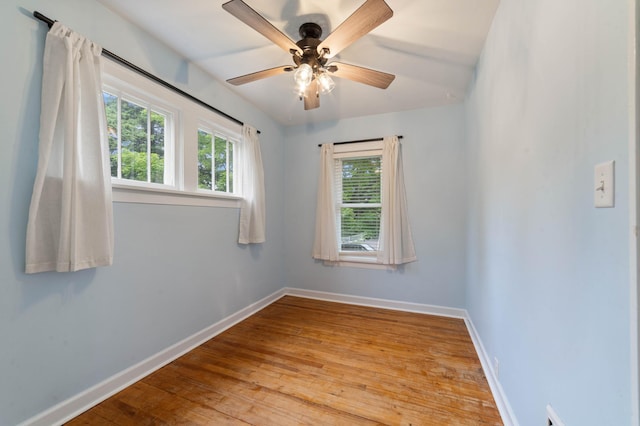 1921 Minneapolis Ave, Duluth, MN 55803 - unfurnished room with healthy amount of natural light, hardwood / wood-style floors, and ceiling fan