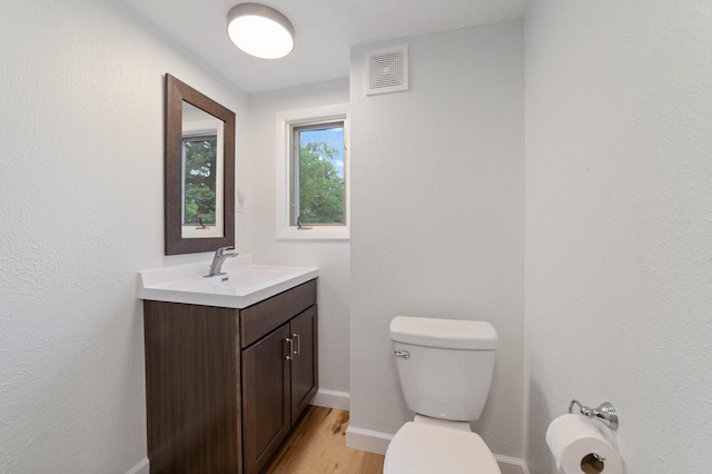 1921 Minneapolis Ave, Duluth, MN 55803 - half bathroom with vanity and wood finished floors
