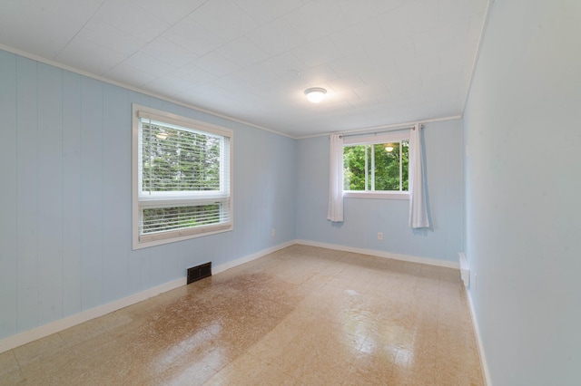 1921 Minneapolis Ave, Duluth, MN 55803 - spare room featuring crown molding and tile patterned floors