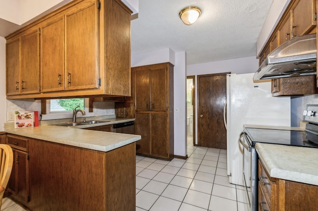 1501 100th St, Bloomington, MN 55431 - kitchen featuring appliances with stainless steel finishes, exhaust hood, light countertops, a peninsula, and brown cabinets
