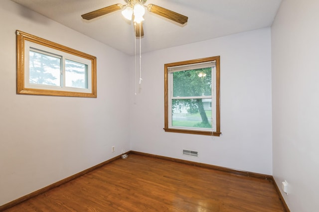 1501 100th St, Bloomington, MN 55431 - empty room with wood finished floors and ceiling fan
