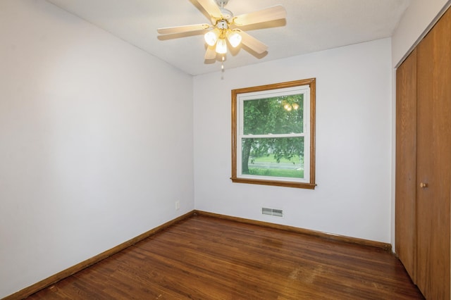 1501 100th St, Bloomington, MN 55431 - unfurnished bedroom featuring a closet, dark wood-style floors, and ceiling fan