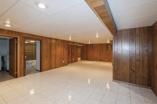 1501 100th St, Bloomington, MN 55431 - empty room featuring wooden walls and light tile patterned flooring