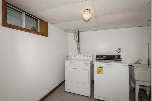 1501 100th St, Bloomington, MN 55431 - laundry area featuring washer and dryer and light tile patterned floors