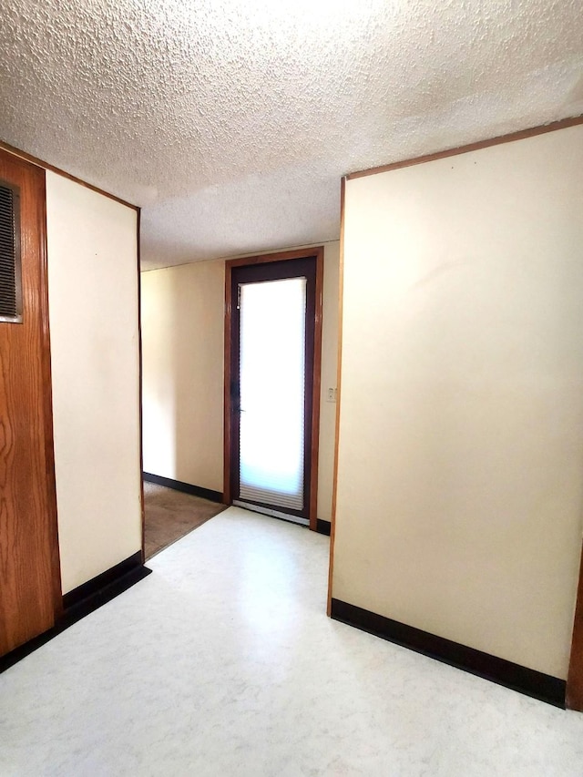 1329 US Highway 8, Balsam Lake, WI 54001 - empty room with baseboards and a textured ceiling
