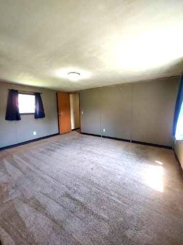 1329 US Highway 8, Balsam Lake, WI 54001 - unfurnished room with light carpet and baseboards