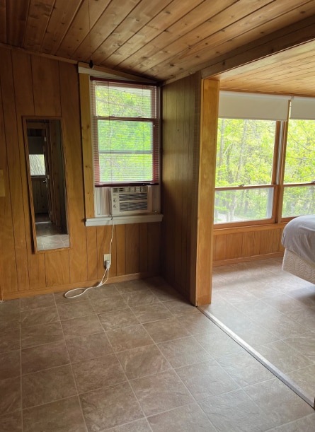 33252 Librarian Ln, Laporte, MN 56461 - spare room featuring wooden ceiling, cooling unit, wooden walls, and vaulted ceiling