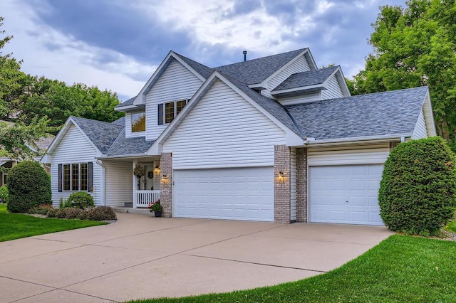 14078 Quince St NW, Andover, MN 55304 - traditional home with a garage, driveway, a shingled roof, and brick siding