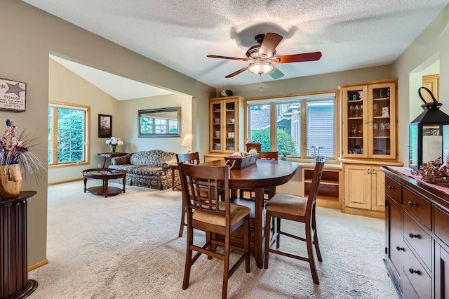 14078 Quince St NW, Andover, MN 55304 - dining area with light carpet, ceiling fan, a textured ceiling, and vaulted ceiling