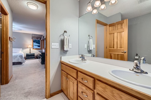 14078 Quince St NW, Andover, MN 55304 - ensuite bathroom with double vanity and a textured ceiling
