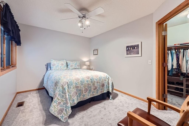 14078 Quince St NW, Andover, MN 55304 - carpeted bedroom featuring a textured ceiling, a closet, and ceiling fan