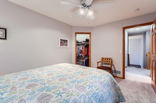 14078 Quince St NW, Andover, MN 55304 - bedroom with light colored carpet, a ceiling fan, a spacious closet, and a closet