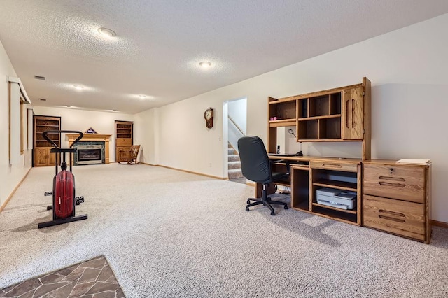 14078 Quince St NW, Andover, MN 55304 - home office with a textured ceiling, carpet floors, and a fireplace