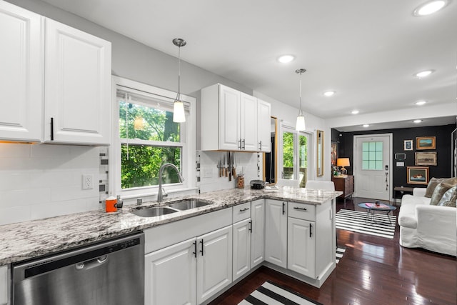 610 34th Ave N, Minneapolis, MN 55412 - kitchen with stainless steel dishwasher, healthy amount of natural light, dark wood finished floors, open floor plan, and recessed lighting