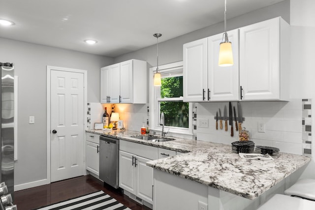 610 34th Ave N, Minneapolis, MN 55412 - kitchen featuring stainless steel appliances, white cabinetry, pendant lighting, a peninsula, and recessed lighting