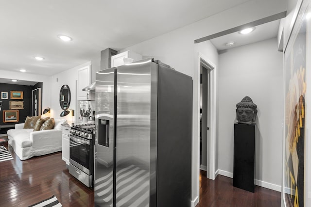 610 34th Ave N, Minneapolis, MN 55412 - kitchen with appliances with stainless steel finishes, dark wood-style flooring, and recessed lighting