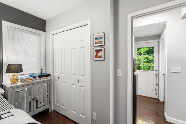 610 34th Ave N, Minneapolis, MN 55412 - bedroom with dark wood-style flooring and a closet