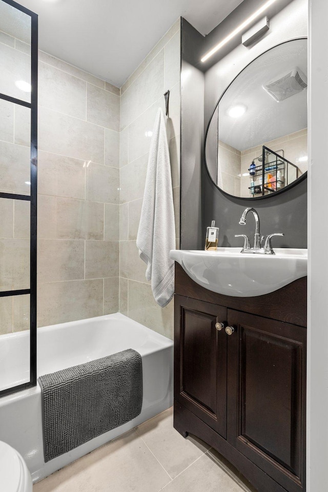 610 34th Ave N, Minneapolis, MN 55412 - full bathroom featuring tile patterned flooring, vanity, and bathing tub / shower combination