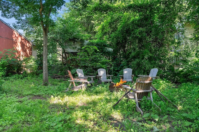 610 34th Ave N, Minneapolis, MN 55412 - view of yard with an outdoor fire pit