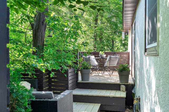 610 34th Ave N, Minneapolis, MN 55412 - wooden terrace with outdoor dining area