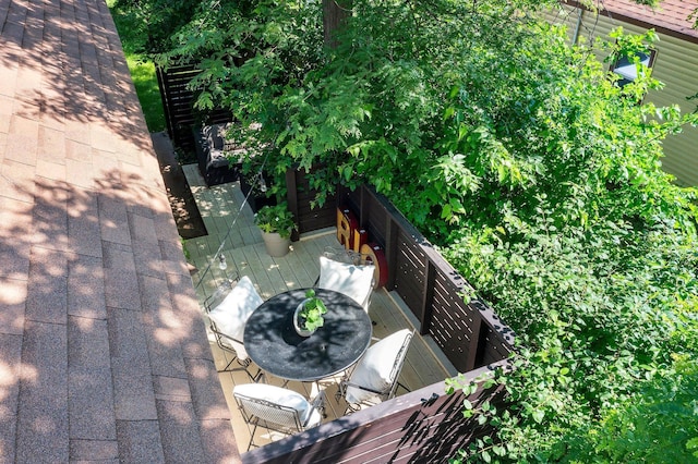 610 34th Ave N, Minneapolis, MN 55412 - view of wooden balcony featuring a deck and outdoor dining area