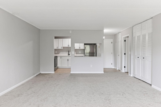 10501 Cedar Lake Rd Unit 515, Minnetonka, MN 55305 - unfurnished living room with light carpet and baseboards