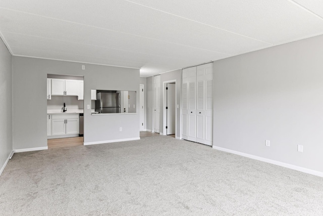 10501 Cedar Lake Rd Unit 515, Minnetonka, MN 55305 - unfurnished living room featuring light carpet and baseboards