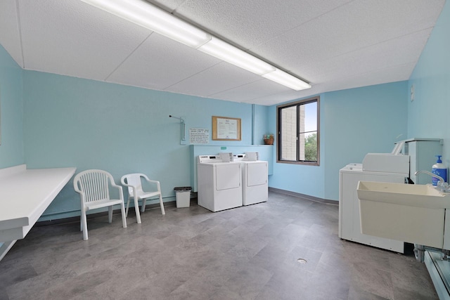 10501 Cedar Lake Rd Unit 515, Minnetonka, MN 55305 - community laundry featuring washer and dryer, a textured ceiling, and tile patterned floors