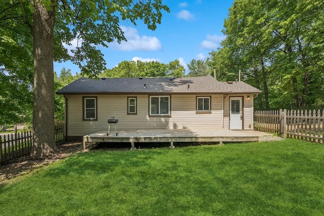 2900 Tuxedo Blvd, Mound, MN 55364 - back of house with a fenced backyard, a deck, and a shingled roof