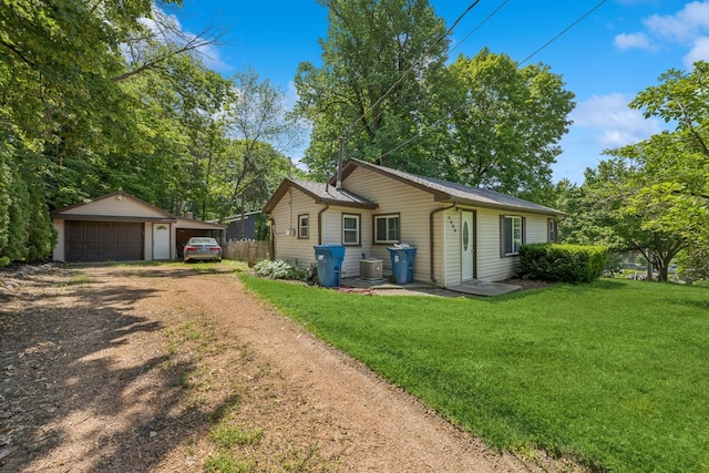 2900 Tuxedo Blvd, Mound, MN 55364 - view of front of house featuring an outdoor structure, a garage, and a front lawn