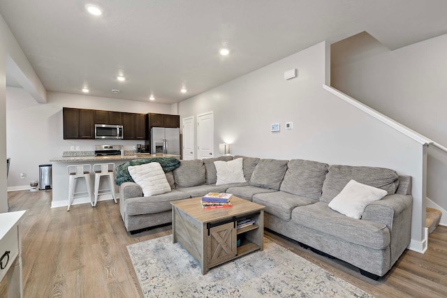11242 131st Cir N, Dayton, MN 55327 - living area with recessed lighting and light wood-style floors