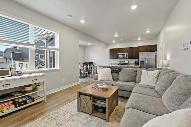 11242 131st Cir N, Dayton, MN 55327 - living area with recessed lighting and light wood-style floors