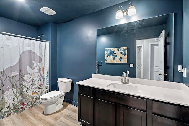 11242 131st Cir N, Dayton, MN 55327 - full bath featuring wood finished floors, vanity, a shower with curtain, and a textured ceiling