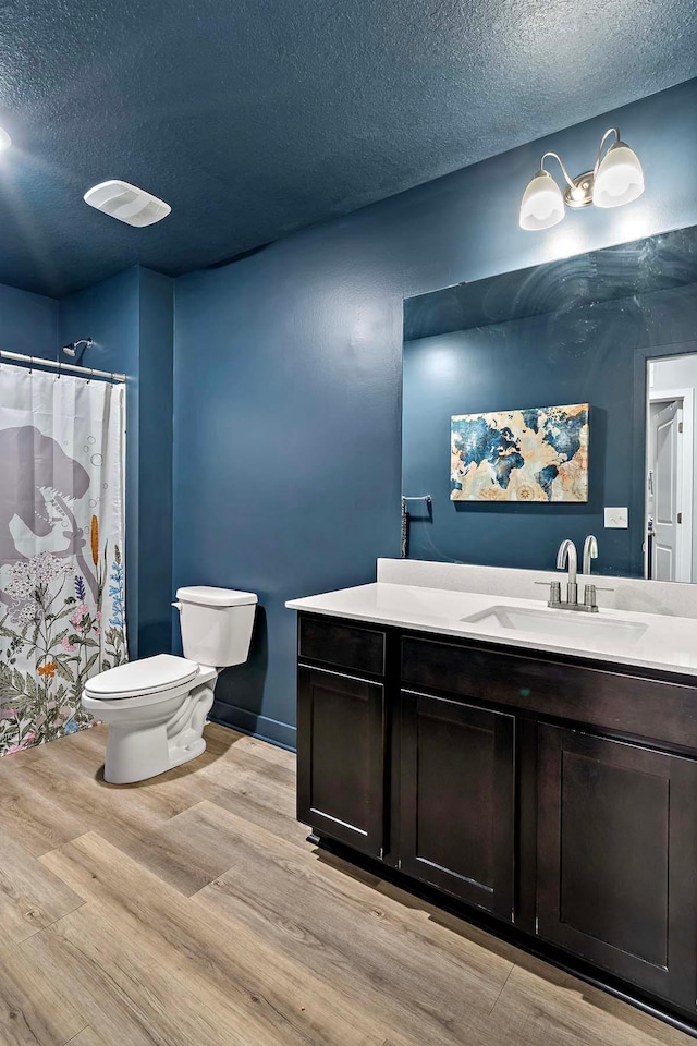11242 131st Cir N, Dayton, MN 55327 - full bath featuring a textured ceiling, wood finished floors, vanity, and curtained shower