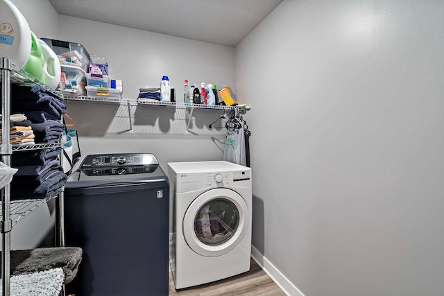 11242 131st Cir N, Dayton, MN 55327 - washroom featuring separate washer and dryer and wood finished floors