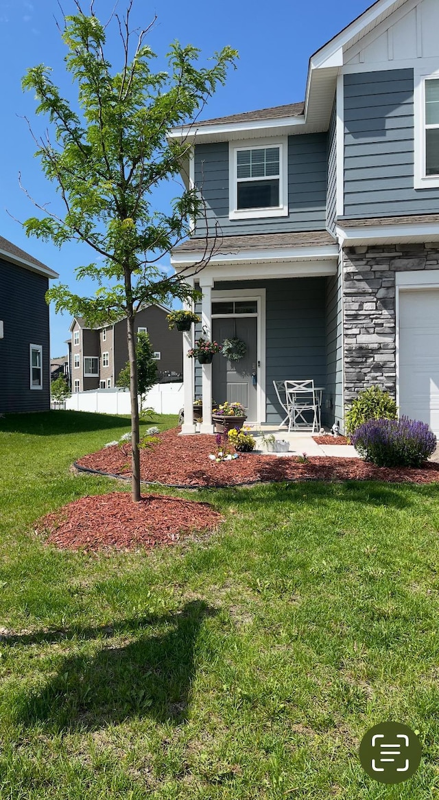 11242 131st Cir N, Dayton, MN 55327 - view of front facade featuring a front lawn and stone siding