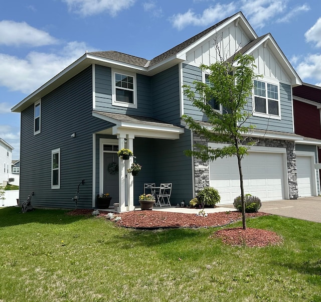 11242 131st Cir N, Dayton, MN 55327 - view of front of property with a garage, a front yard, board and batten siding, and driveway