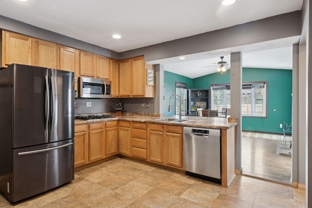 7632 Dupont Ave S, Richfield, MN 55423 - kitchen featuring stainless steel appliances, vaulted ceiling, ceiling fan, a peninsula, and recessed lighting