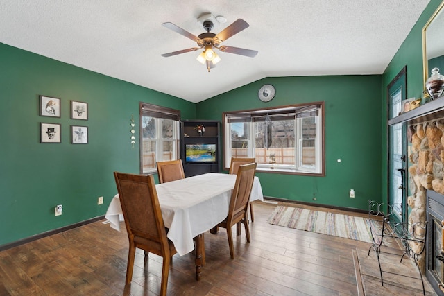 7632 Dupont Ave S, Richfield, MN 55423 - dining room with wood finished floors, a ceiling fan, vaulted ceiling, and a textured ceiling