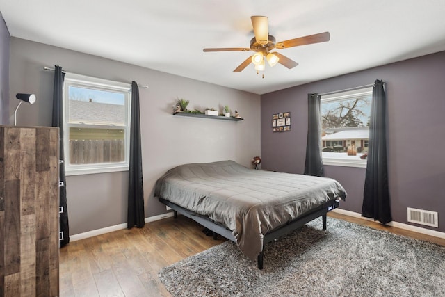 7632 Dupont Ave S, Richfield, MN 55423 - bedroom with light wood-type flooring and ceiling fan