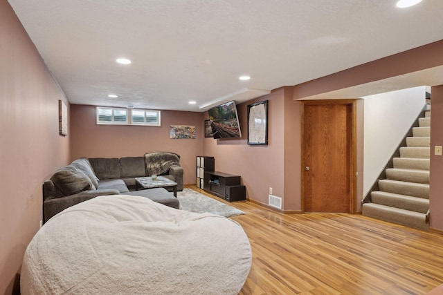7632 Dupont Ave S, Richfield, MN 55423 - living room with light wood-style flooring, recessed lighting, and stairway