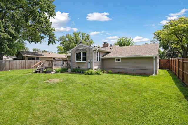 7632 Dupont Ave S, Richfield, MN 55423 - back of property featuring a fenced backyard, a deck, and a chimney