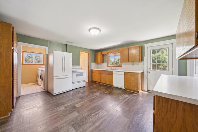 N3752 County Road K, Trenton Twp, WI 54014 - kitchen featuring white appliances, separate washer and dryer, brown cabinets, light countertops, and dark wood-style floors