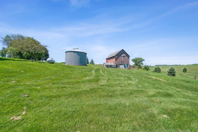 N3752 County Road K, Trenton Twp, WI 54014 - view of green lawn featuring a barn, an outdoor structure, and a view of rural / pastoral area