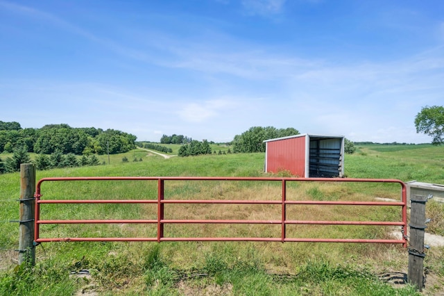 N3752 County Road K, Trenton Twp, WI 54014 - gate with a view of rural / pastoral area, a pole building, and an outbuilding
