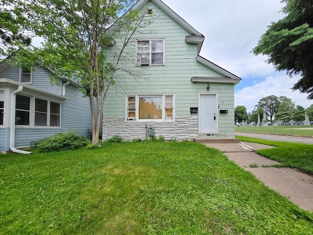 35 Front Ave, Saint Paul, MN 55117 - view of front of home featuring a front lawn, stone siding, and cooling unit