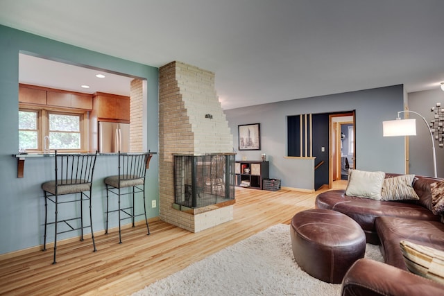 1030 Idaho Ave N, Golden Valley, MN 55427 - living area featuring wood finished floors and a fireplace