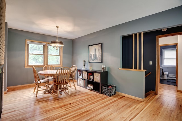 1030 Idaho Ave N, Golden Valley, MN 55427 - dining area featuring wood finished floors and a chandelier