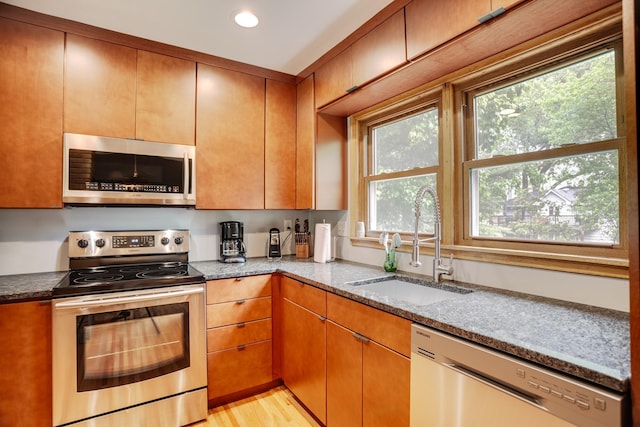 1030 Idaho Ave N, Golden Valley, MN 55427 - kitchen featuring stainless steel appliances, stone counters, recessed lighting, and light wood finished floors